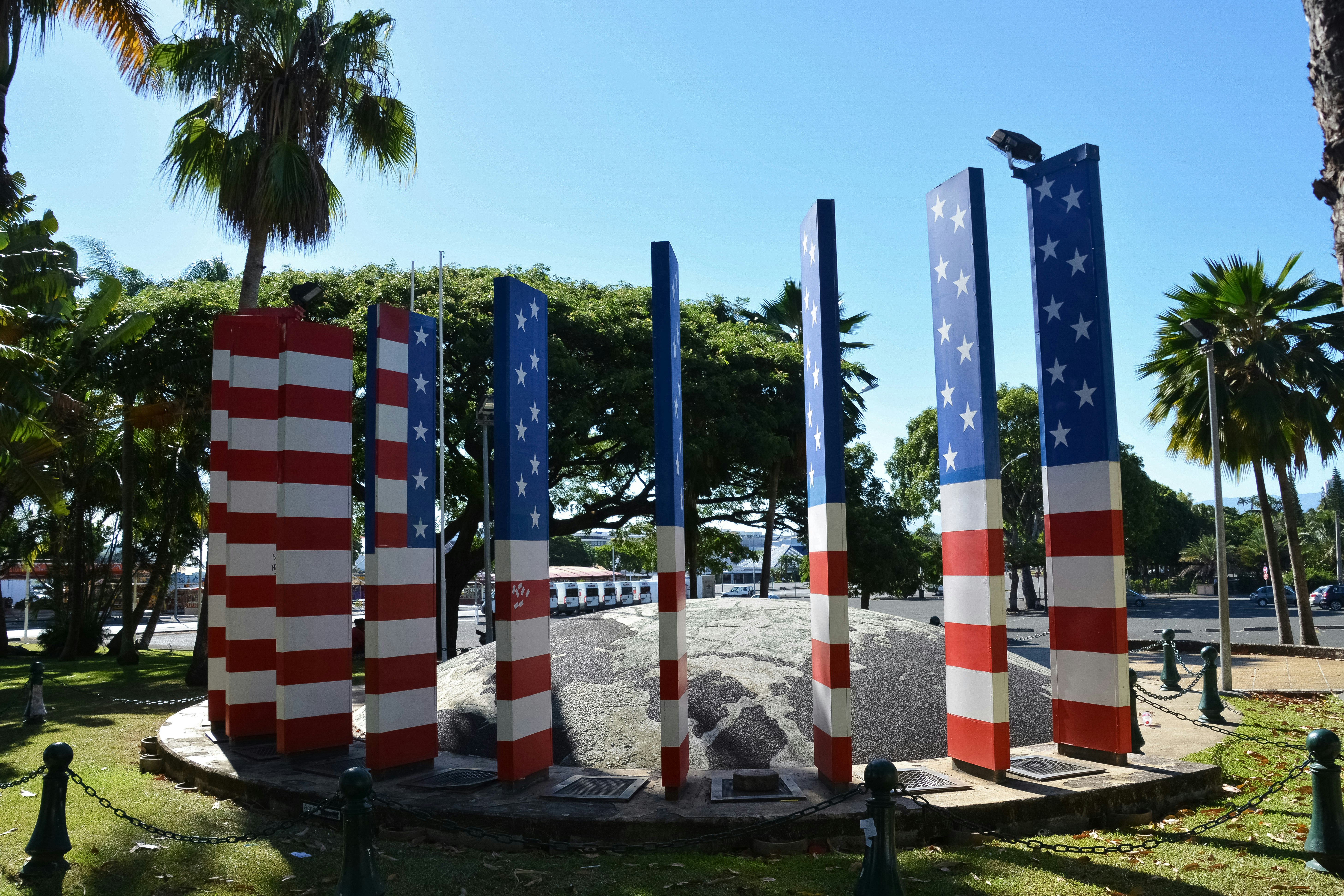 red and white striped flag poles